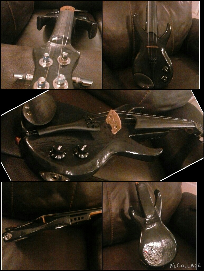 Stratocaster inspired electric violin built and hand-carved from scratch out of red oak, a passive piezo pickup and other electric components, guitar tuning pegs. Black in color.