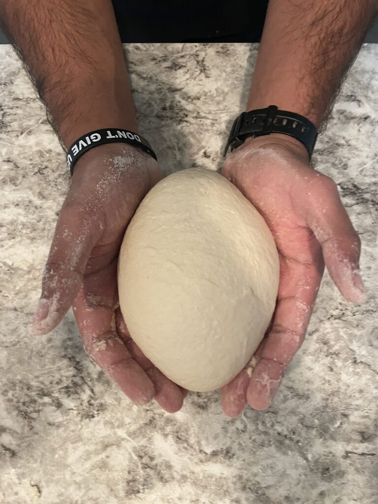 Kneading sourdough bread dough hands kingdom of God is like Yeast Mario Sultan