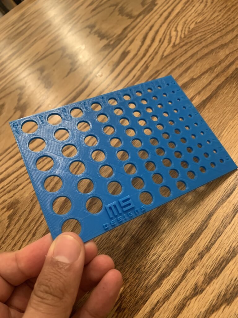 A 3D printer dimensioning and tolerancing gauge to physically baseline a printer and determine what size hole to dimension in CAD versus compensating in the slicer. 