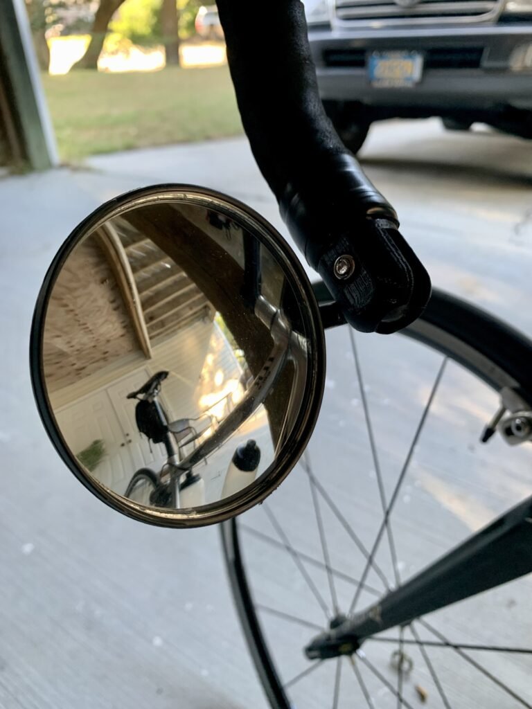 Swiveling Bike Mirror Handlebar Bracket

The bracket that came with the mirror which fits in the end of the handlebar would slip out as I'm riding and the bar is vibrating. So I 3D Printed a more permanent solution which I've been using for 2.5 years so far. I had to print it in PETG because it kept loosening when I made it in PLA and stored in my shed. Also made an end cap on the other side because those pesky things keep falling out.