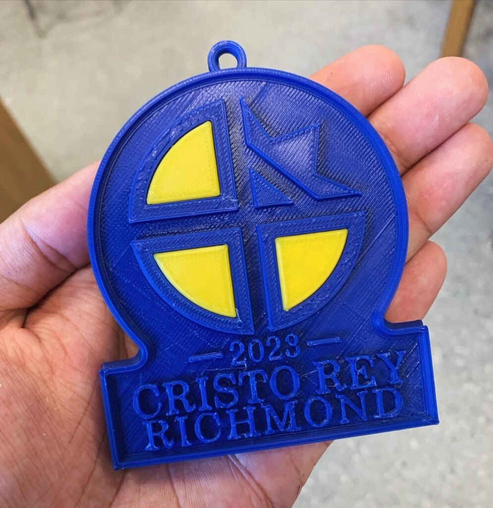 Custom Ornaments for Cristo Rey Richmond High School. Commissioned to create ornaments for our donors. Printed the golden inserts separately and popped them into place. Was given one week to design and print complete them.