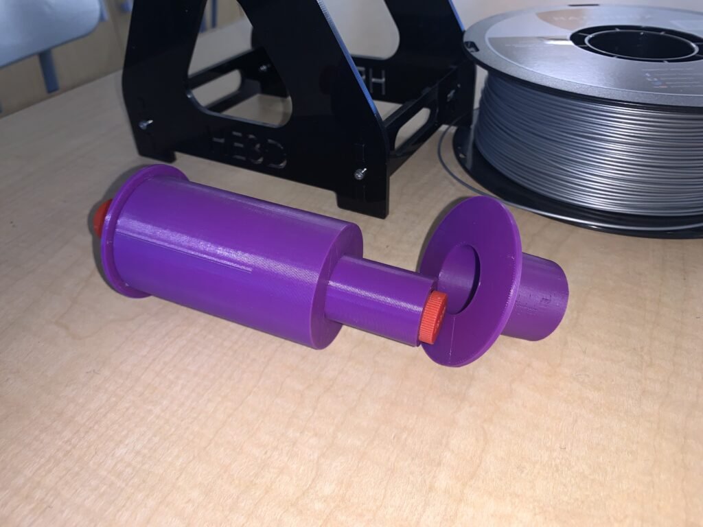 To reduce the rolling resistance of a full spool with the small axel, I created a universal fit adapter to fit every filament spool on this base's axel. Now it rolls easily. One thing to note: it was designed for manufacture, meaning I printed it in two parts the way I did to avoid supports and make it easy to use. 