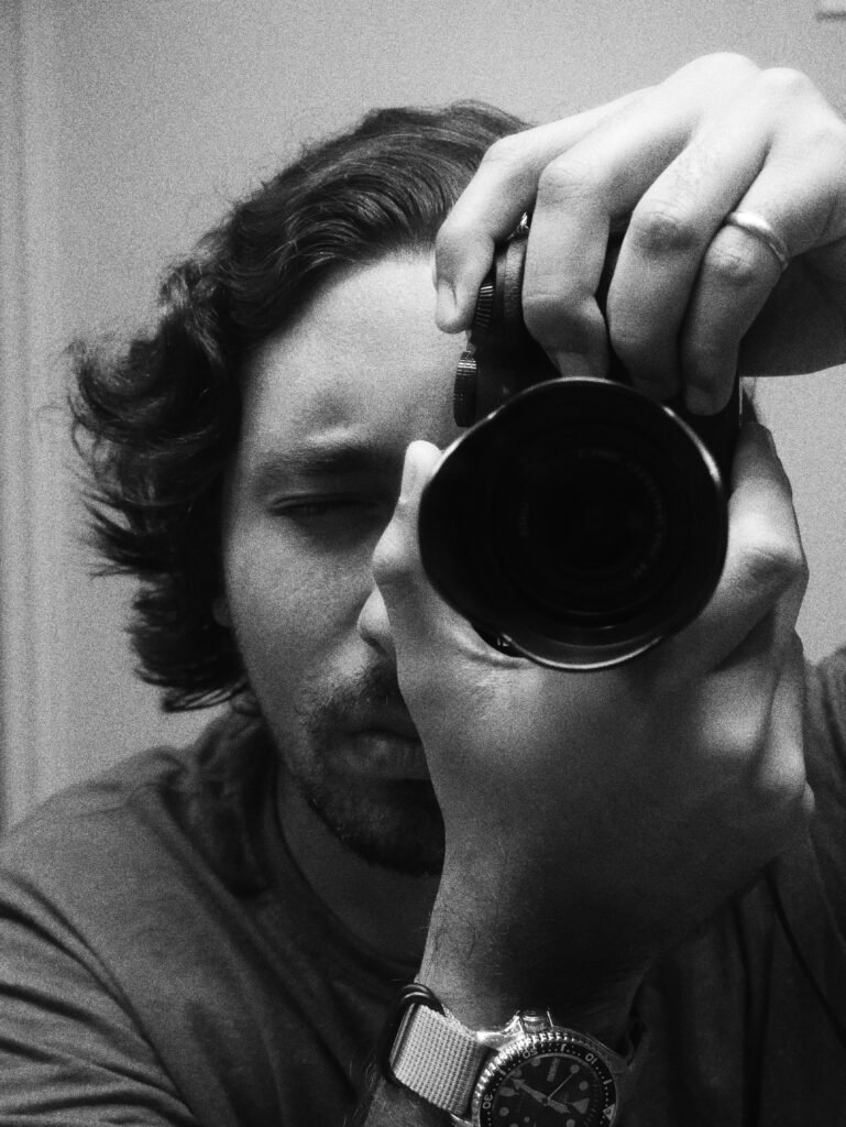 Me holding a camera in the mirror. One of my pursuits during COVID19 was to take more pictures.