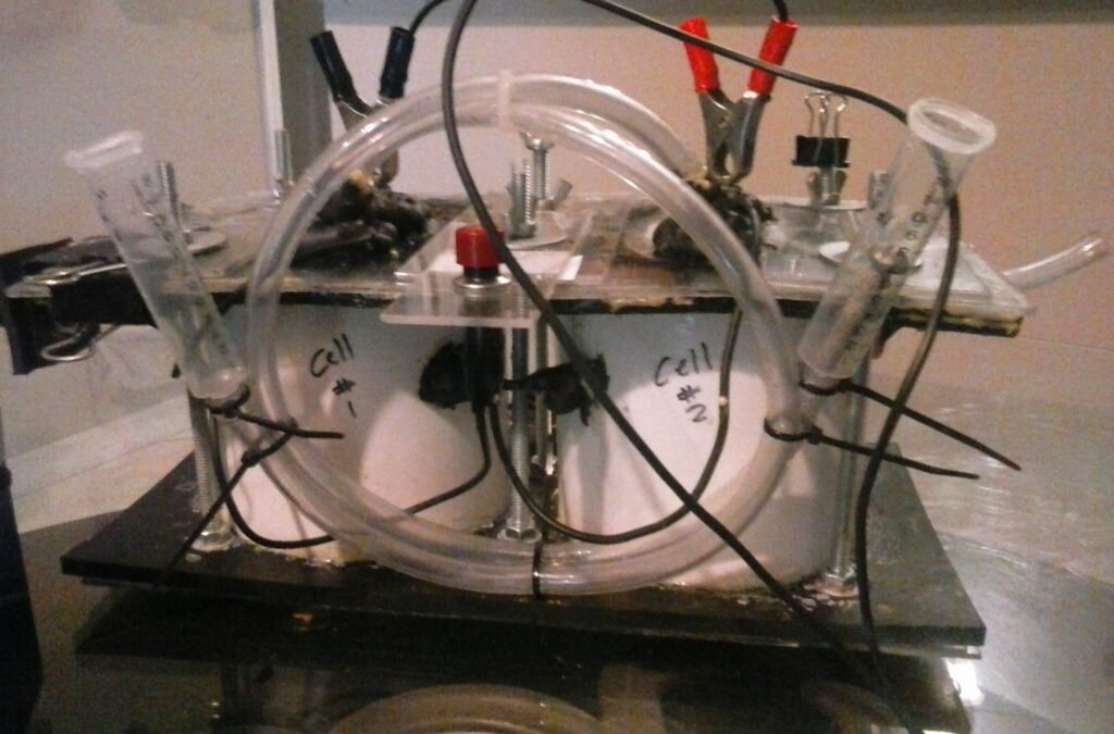 Designed a simple electrolysis fuel cell to illustrate the principle of hydrogen production and its possible implementation in internal combustion applications. Two cells. On/off button. Pipes. 