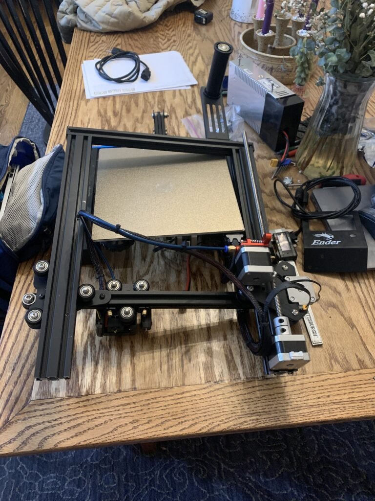 3D Printer taken apart ready to build the folding mechanism. My approach aims to reduce reliance on off-the-shelf components by incorporating more 3D-printed parts.