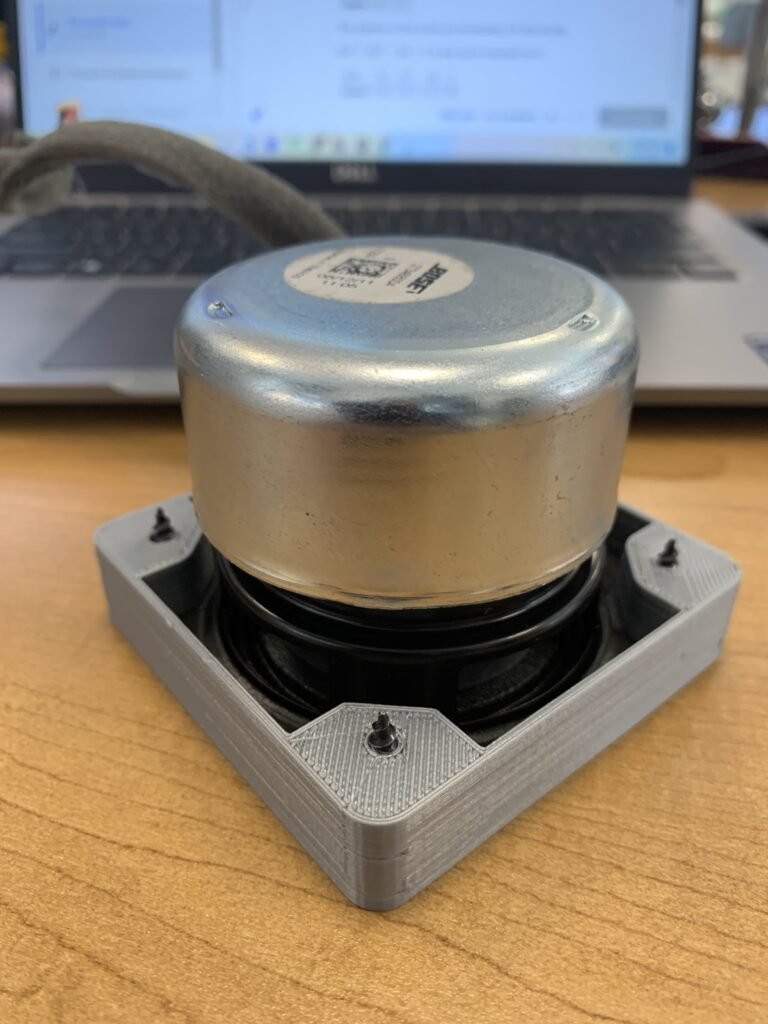 Accurately made bracket (mating surface) for a random speaker my student had. Now that the base is accurate and the screws can be tightened into the plastic, I can design and build more practical parts, such as an enclosure or base. 3D printed in gray. 