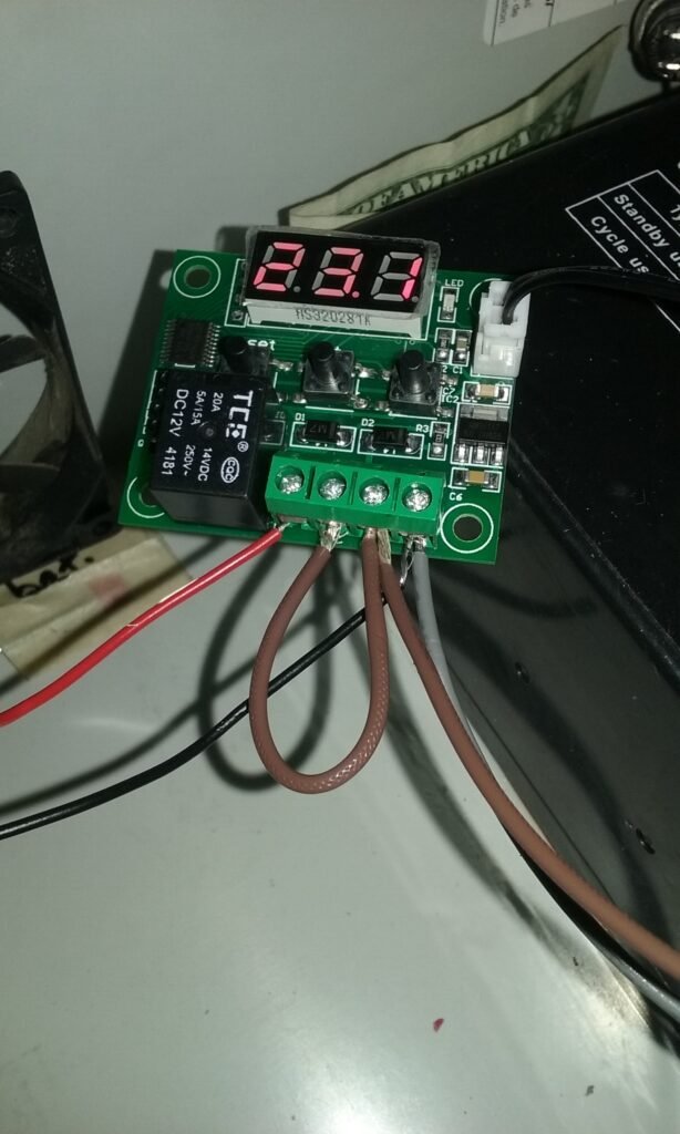 Using a temperature sensor board, thermostat sensor. W1209 Temperature Control Switch (Thermostat Sensor Module). Wired and connected to our device.