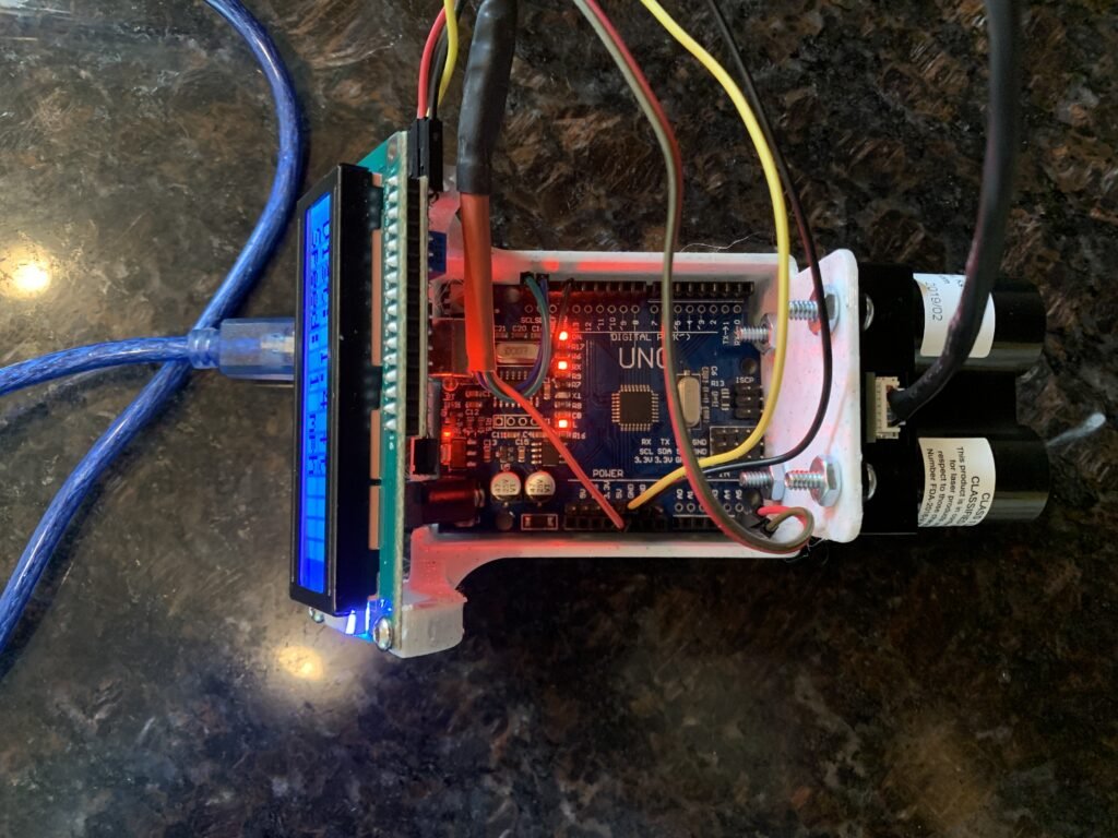 I designed and built a sturdy, functional base to securely hold the Arduino, Garmin LiDAR sensor, LCD display, and all necessary wiring. This robust foundation enables me to prototype a device that measures the distance to the car ahead and detects changes in its speed, providing critical alerts when the vehicle slows down. The base is specifically engineered to support the components during testing, ensuring stability and ease of use throughout the development process.