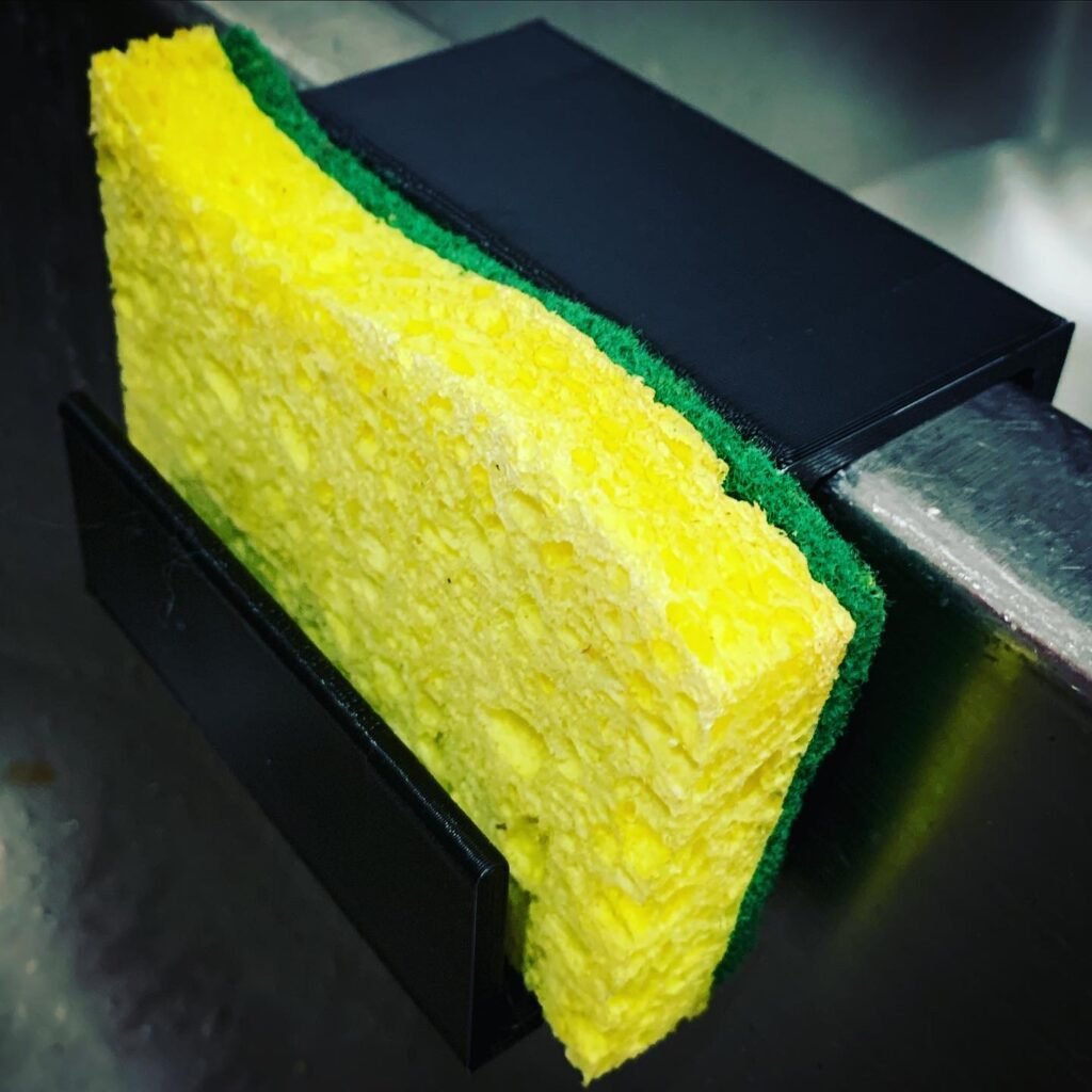 3d printed sponge holder on sink with sponge