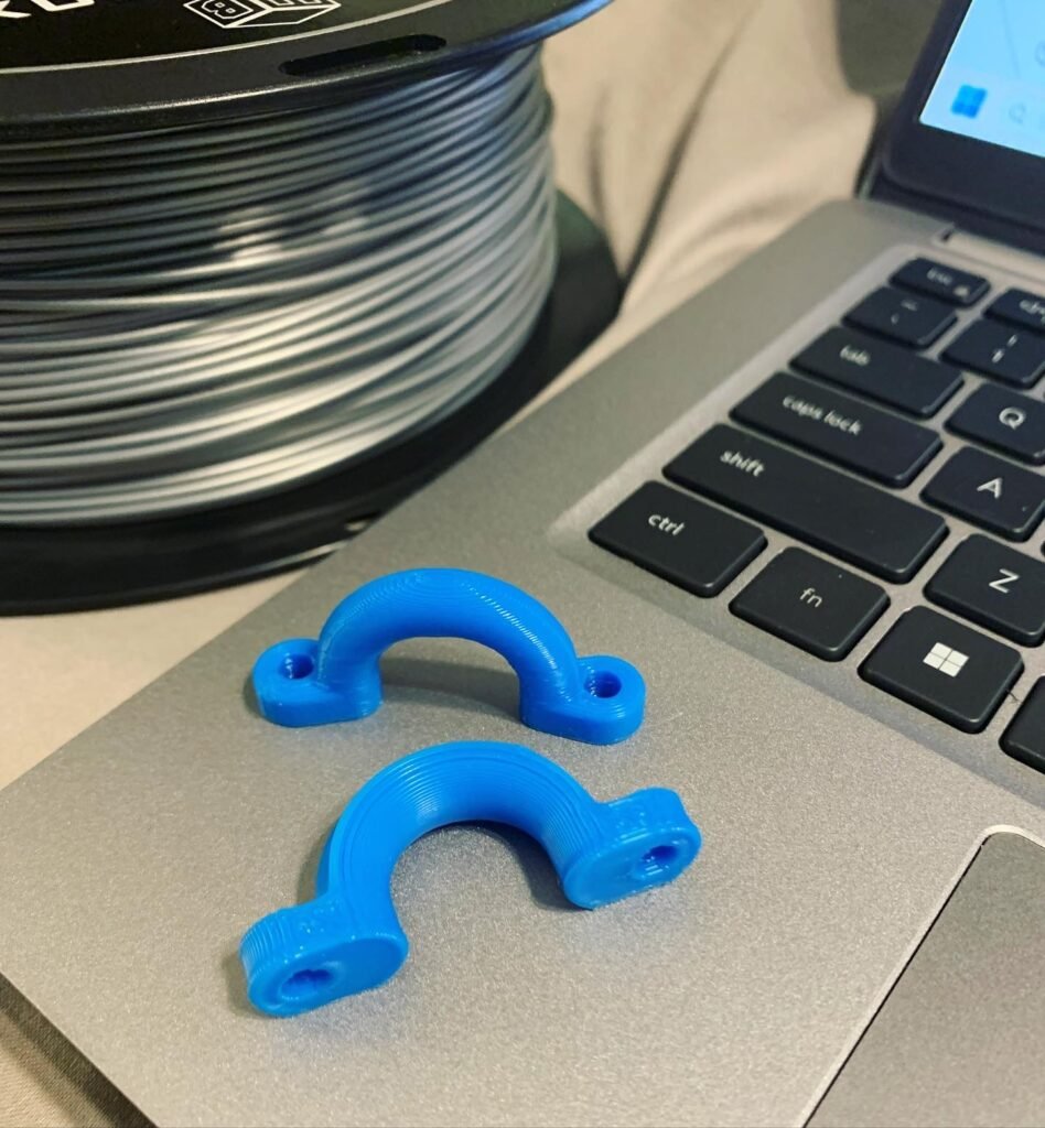 Blue 3d printed Kayak Pad Eye Deck Hoops printed in two different orientations. 