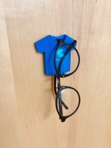 T-shirt Glasses Holder. 3D printed blue sunglasses hook which can be mounted on a wall and hold your glasses/sunglasses. 