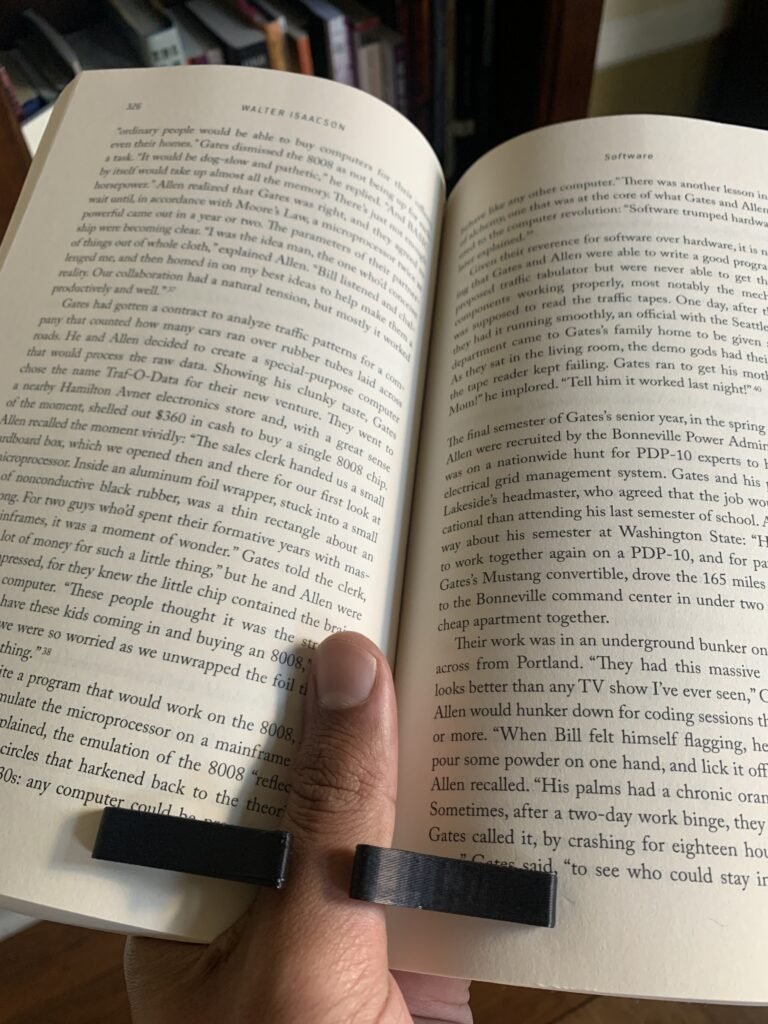 Thumb book page holder, black, modern, curvy, with my thumb. 3d printed