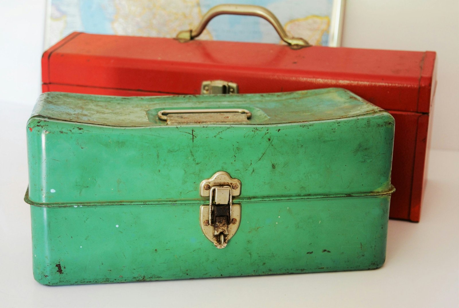 https://unsplash.com/photos/two-rectangular-green-and-red-tool-cases-on-white-surface-2nSdQEd-ExcThis old green toolbox wears its age well and hints at owners long past, their workday woes and triumphs—the daily grind. Susan Holt Simpson